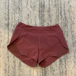 Lululemon red shorts with pleat details